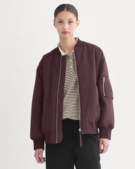 womens-renew-oversized-puffer-bomber-deep-plum | primary