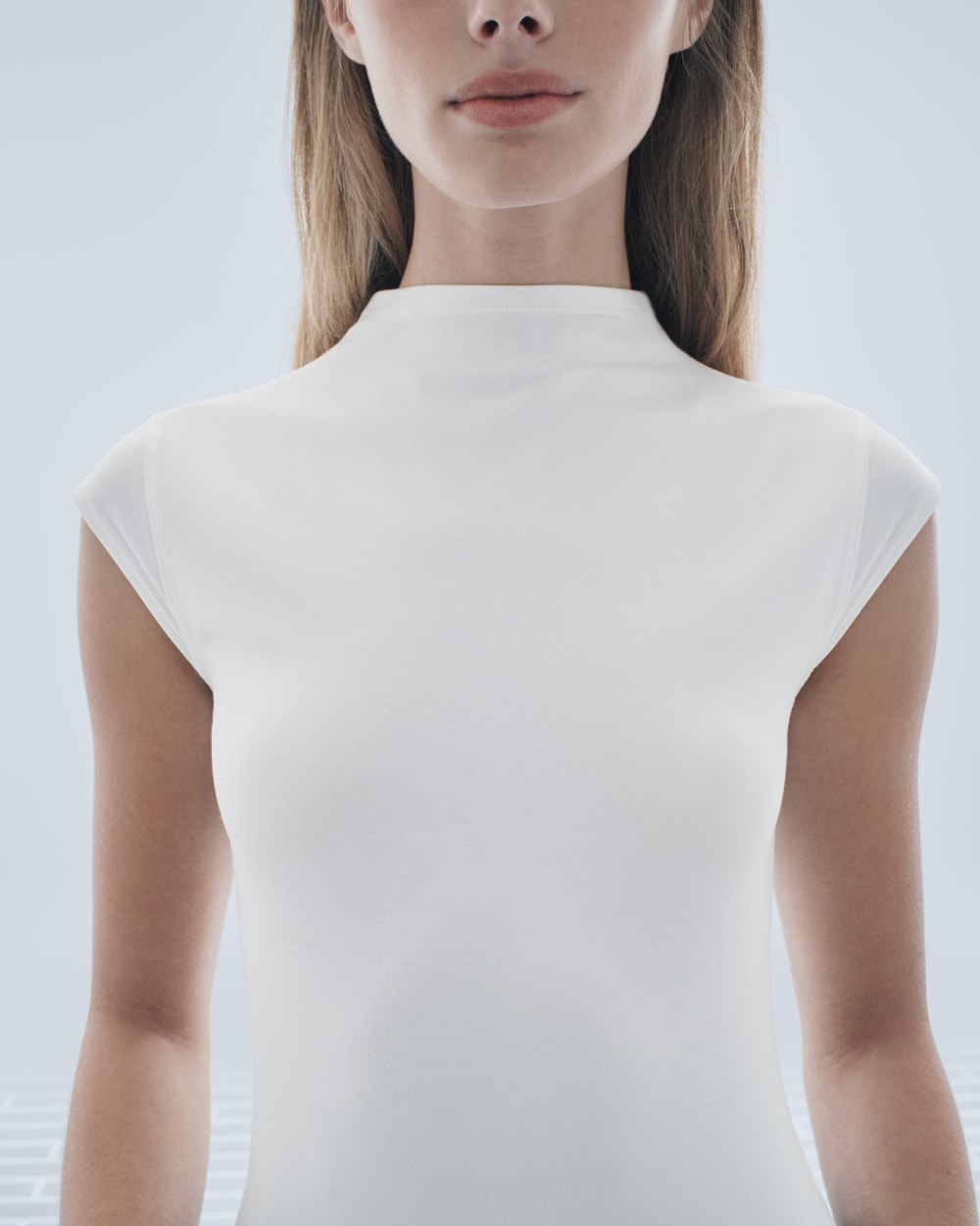 womens-form-funnel-neck-bodysuit-white | editorial