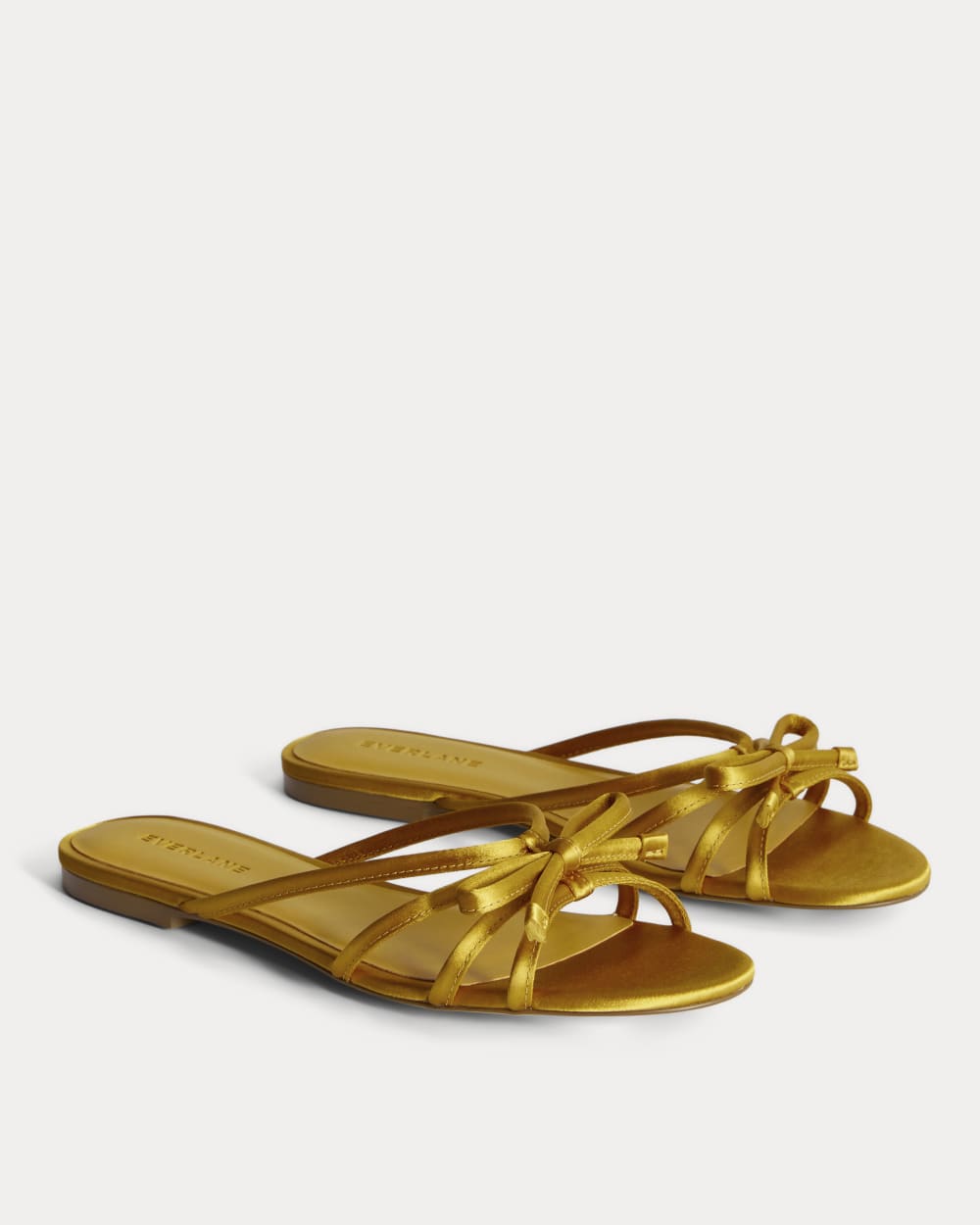 womens-leather-bow-sandal-golden-sun-satin